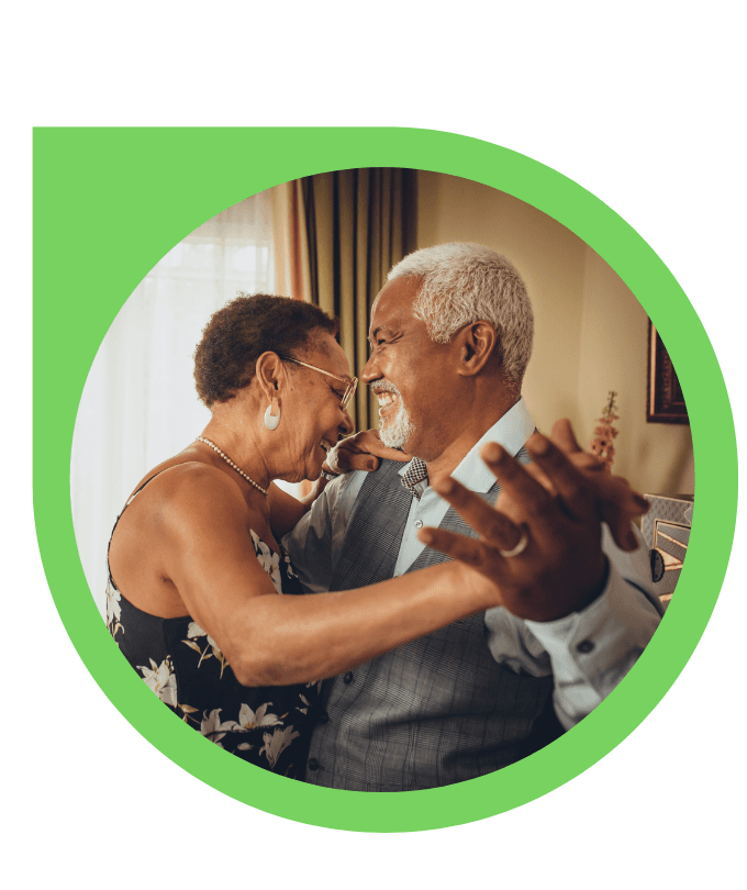 A M&M Caring Hands caregiver supporting a senior woman at home in Indianapolis