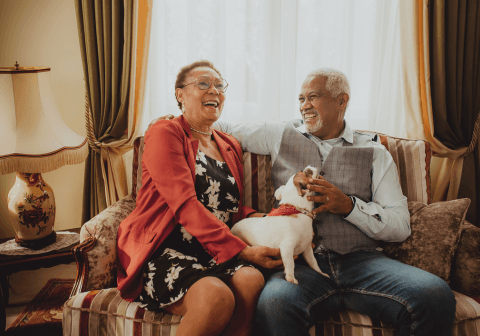 A caregiver sharing a warm moment with a senior woman